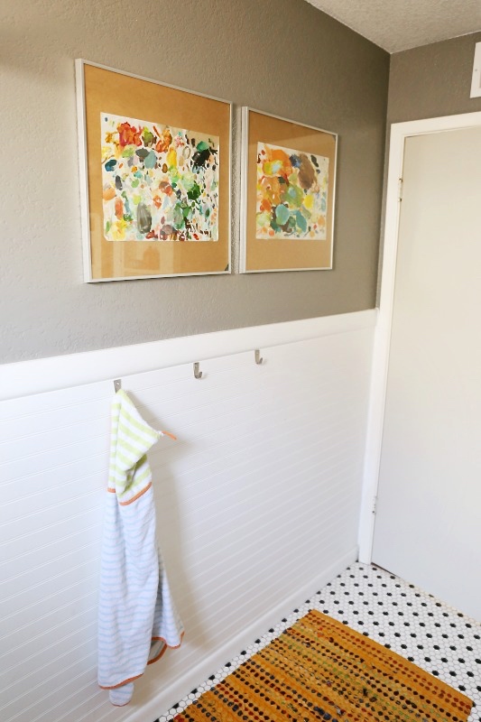Who says you can't have artwork in the bathroom? These colourful pieces are by Beth Allan Art.