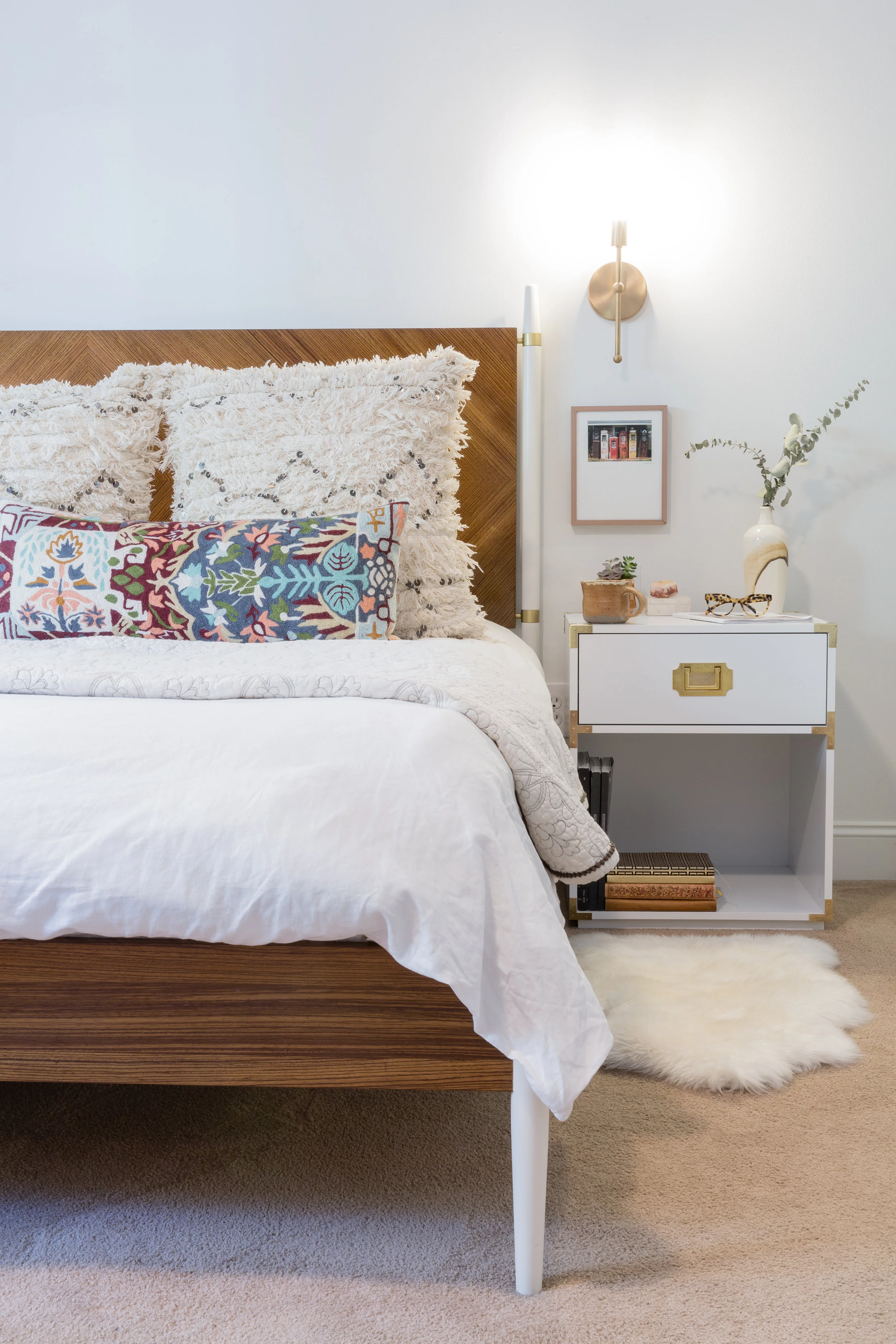 The master bedroom is kept neutral with lots of texture. How stunning is this bed from Anthropology!