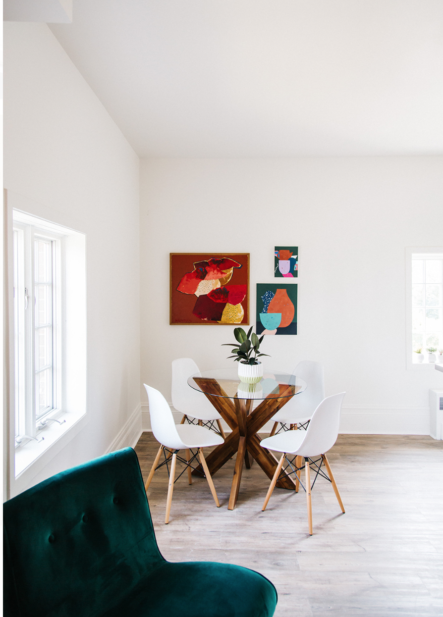 Two of my paintings hanging on the right. Far left available at Dwellisimo .