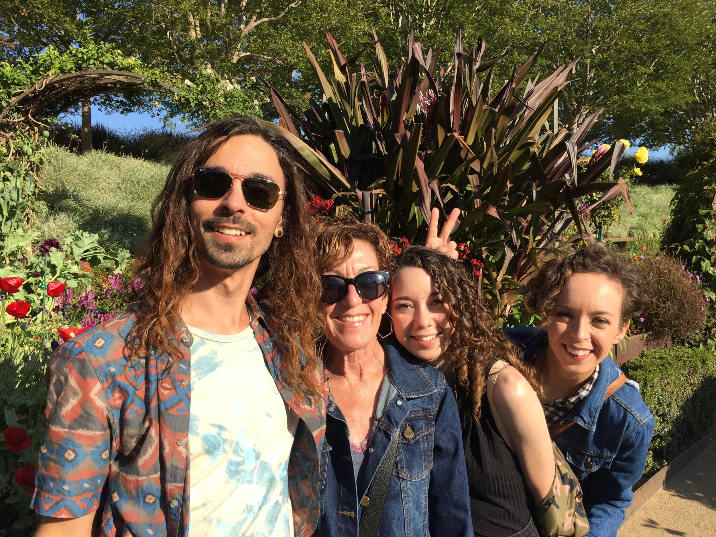  Kia snapped a photo of Jason, my mom, Claire and I soaking up the garden. 