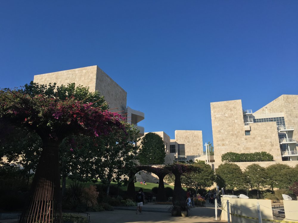  The Getty gardens contain numerous flowers, other plants,&nbsp;fountains, and quotes engraved on some stepping stones. 