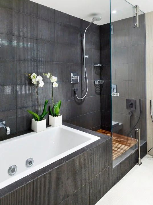 zen bathroom with dark wall tiles