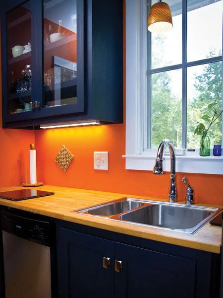 new modern orange and navy kitchen