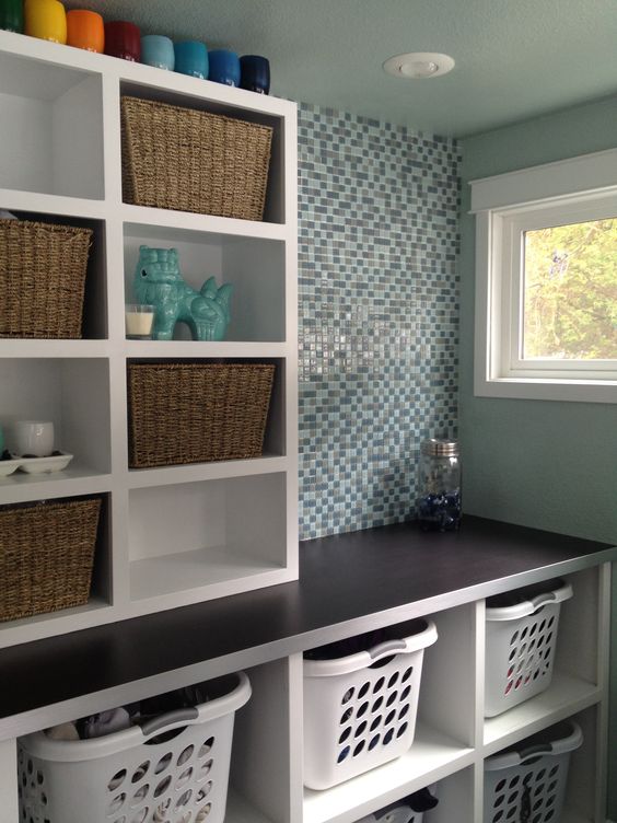 dedicated laundry room with organising shelves and baskets