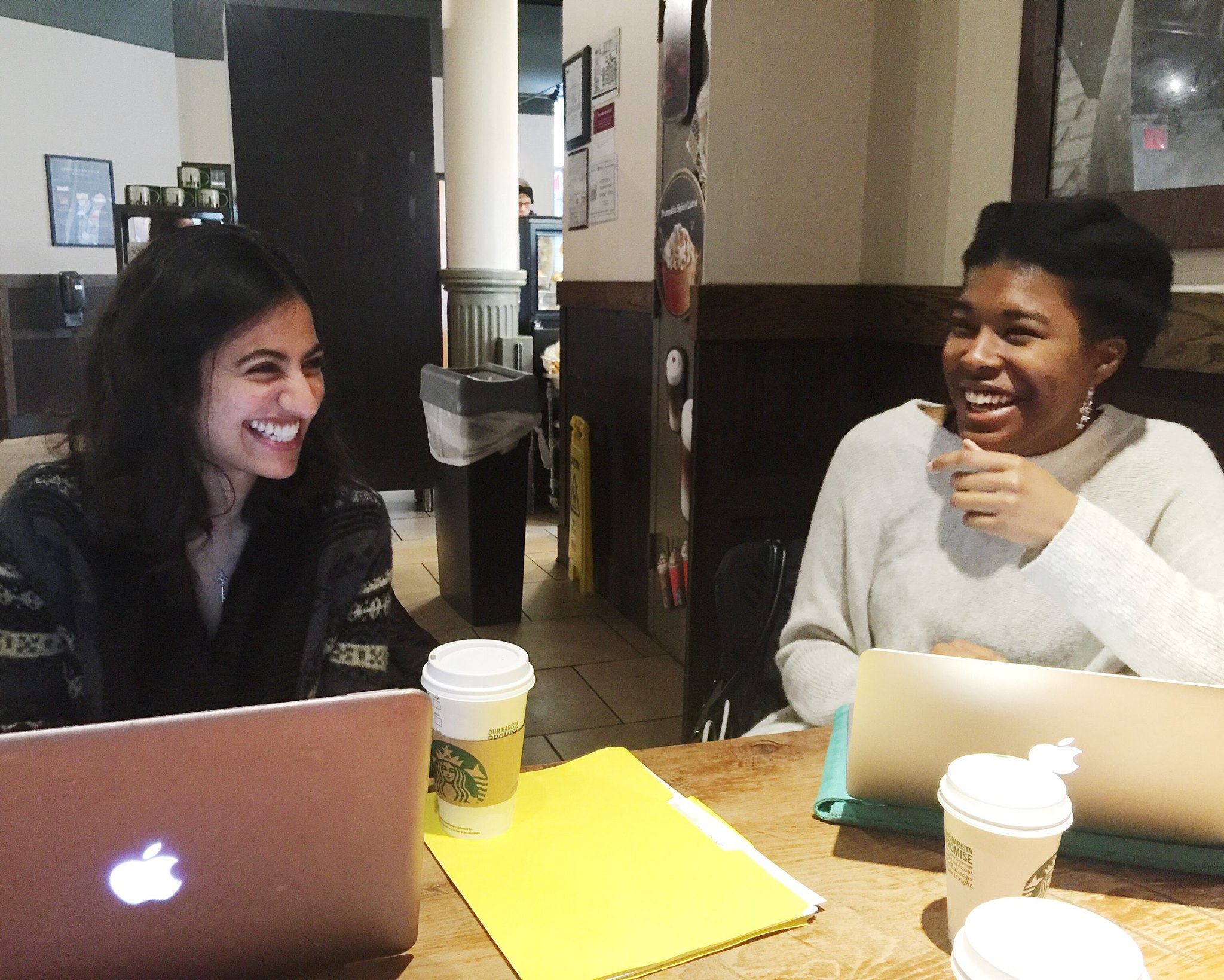 Hediya and McKenzie at a team meeting