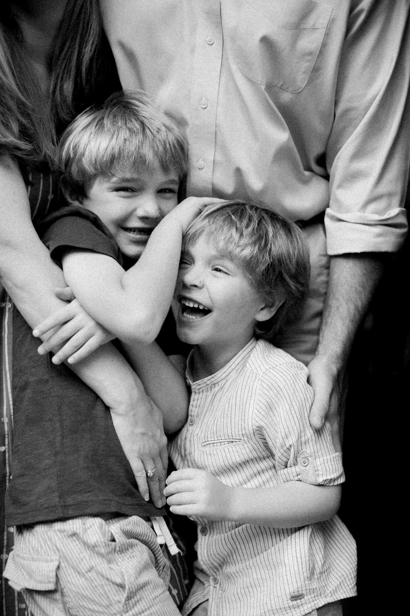 a candid moment of two boys captured on film by photographer anna laero at a pittsburgh family session