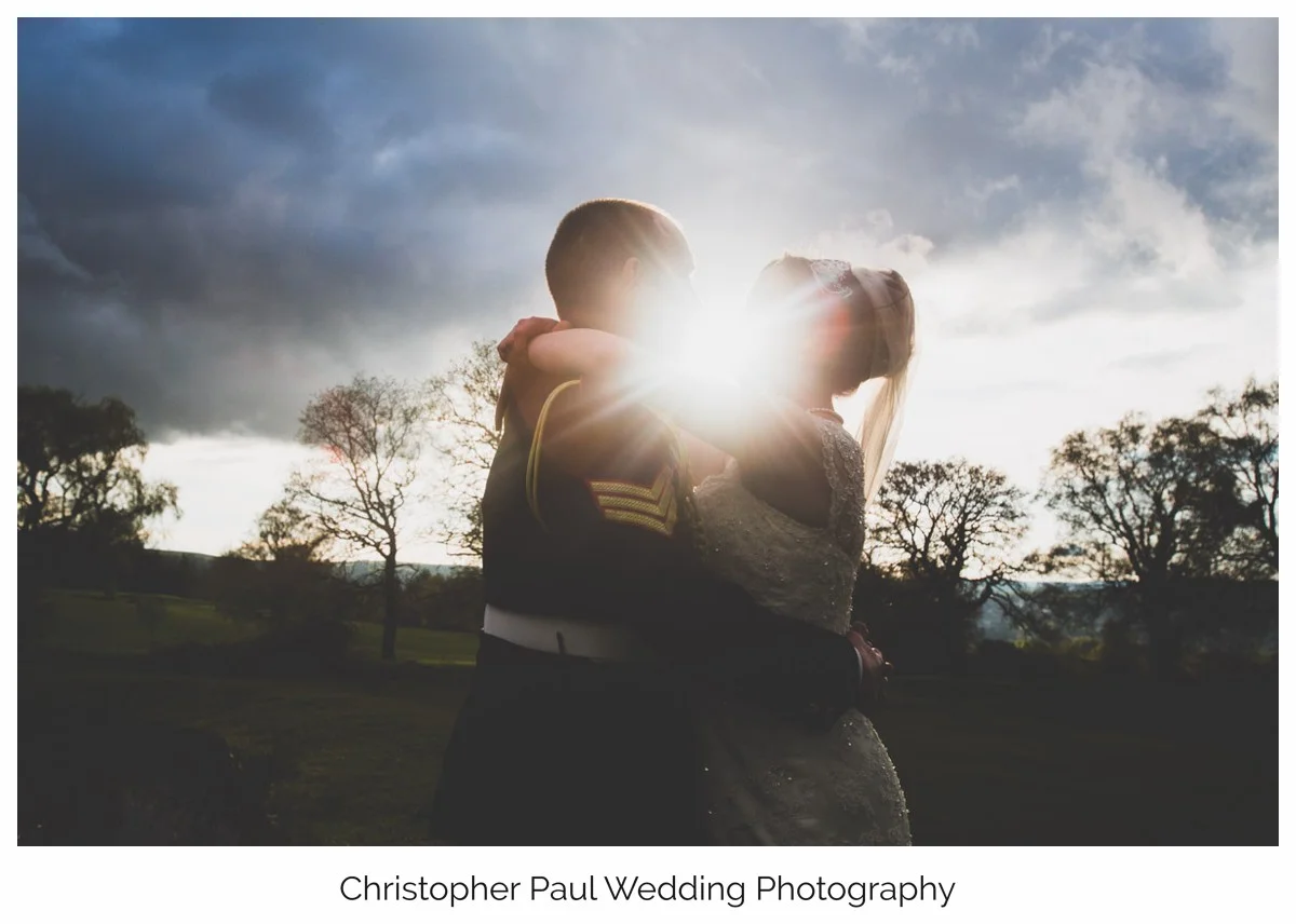 Bride and groom enjoying the Welsh sunset before their first wedding dance.