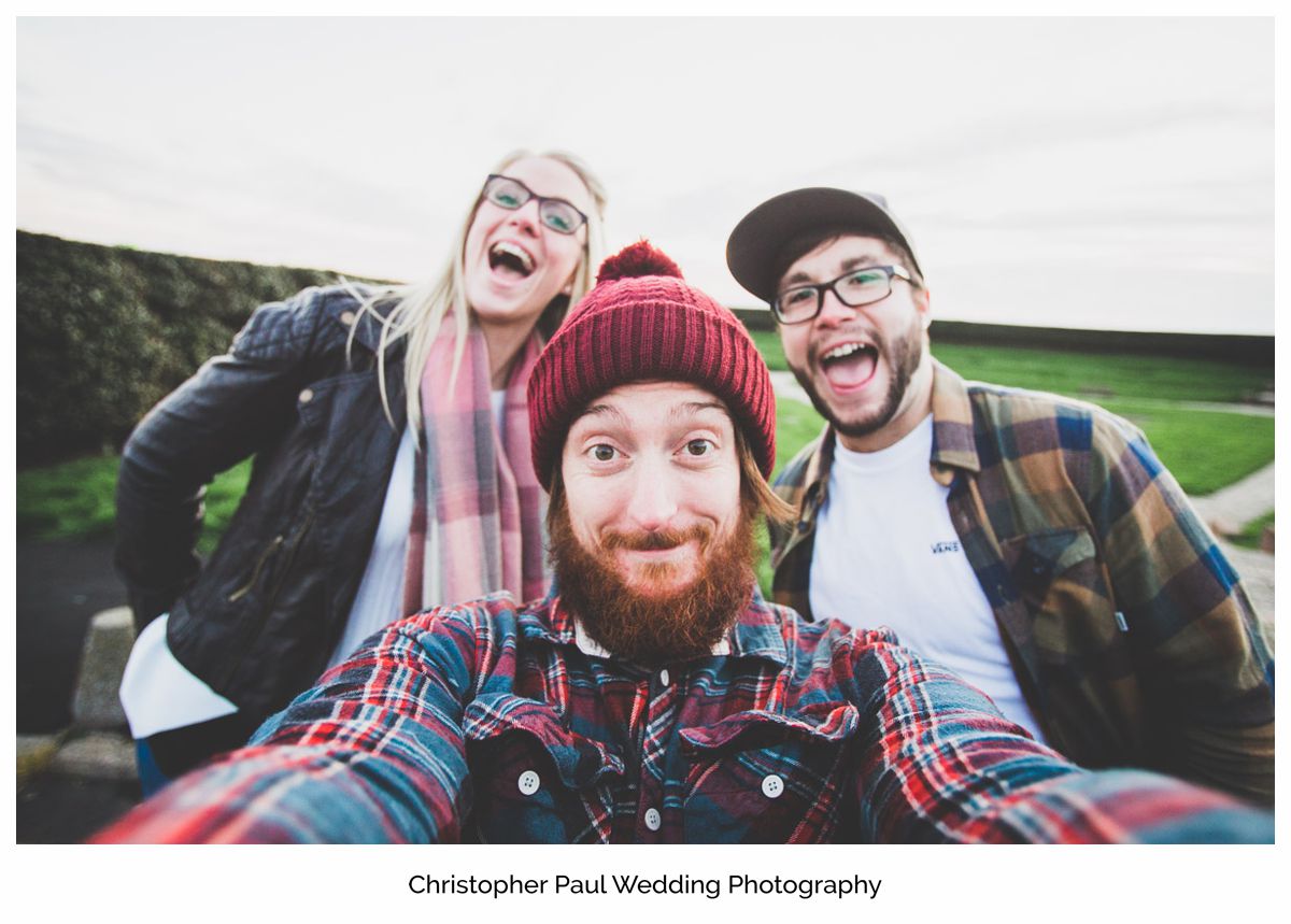 The wedding photographer takes a selfie with the bride and groom to be in Barry South Wales Wedding Photographers