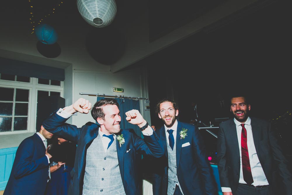 Documentary Wedding Photographers South Wales | The grooms party having fun at the wedding reception
