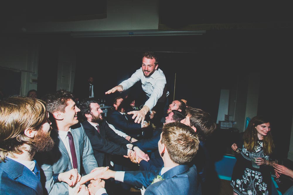 The groom stage diving at his wedding | Alternative south wales wedding photographers