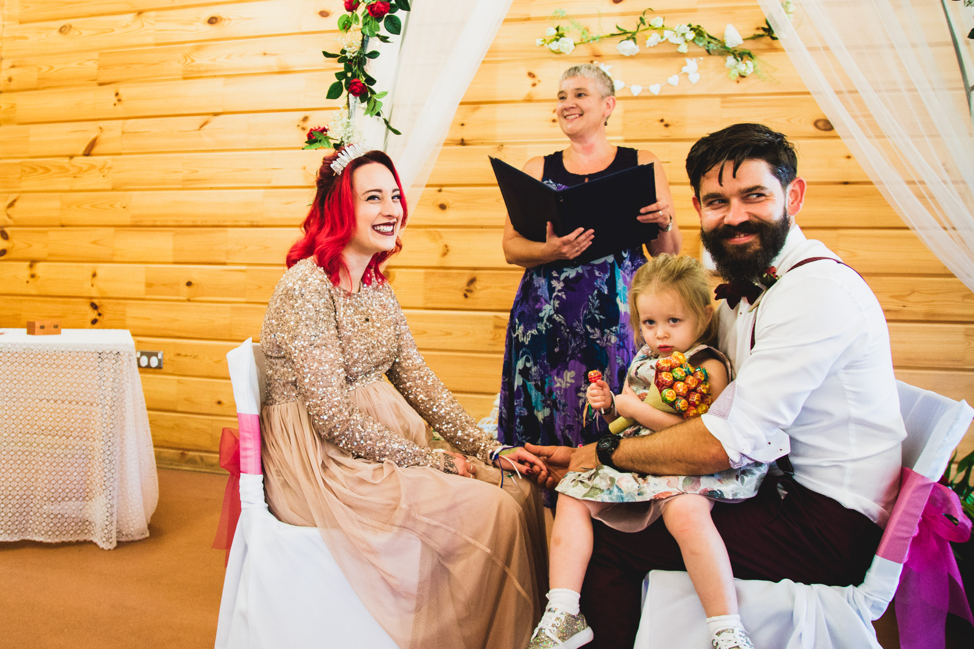 Bride and Groom with daughter at wedding ceremony