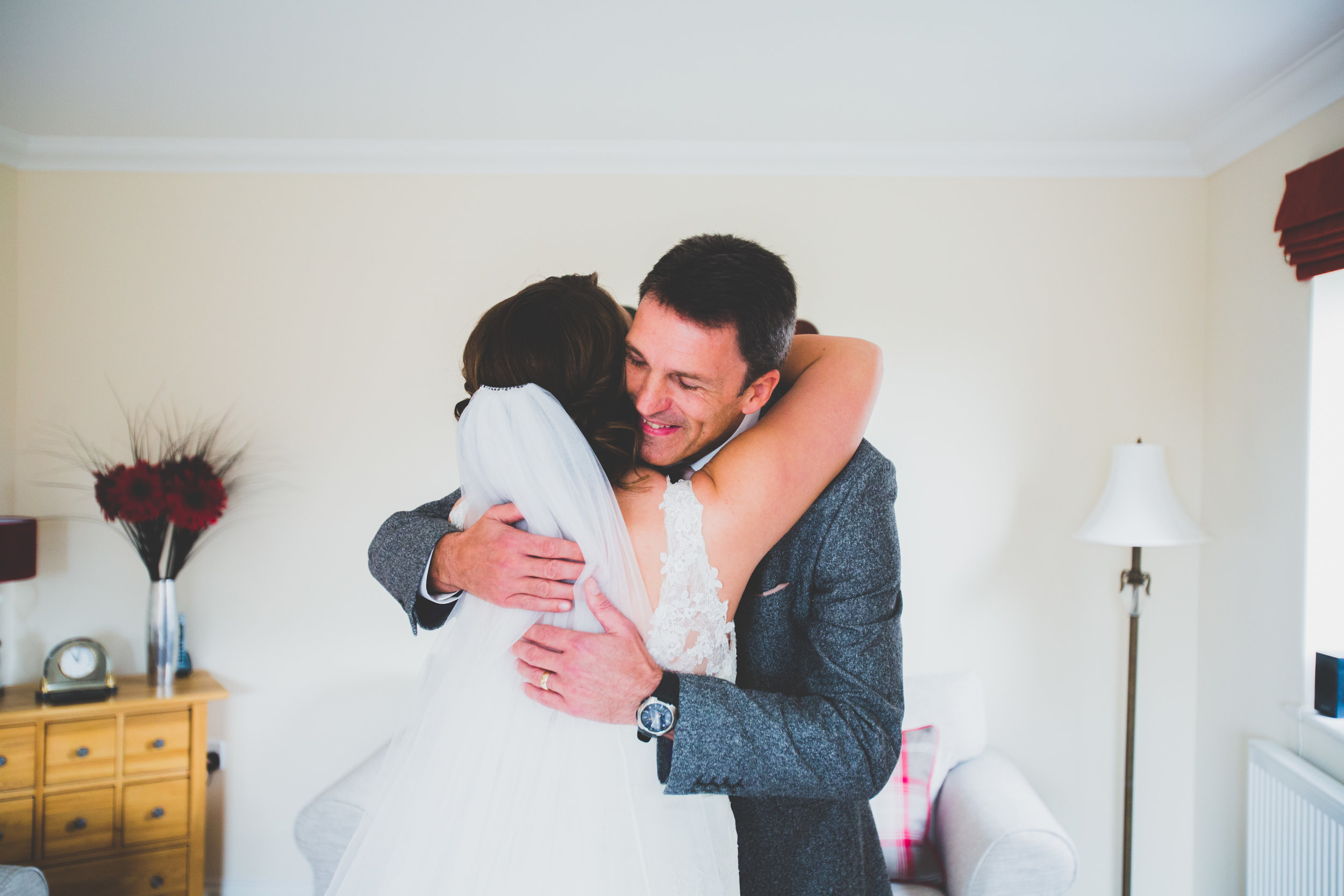 Bride and Her dad hug