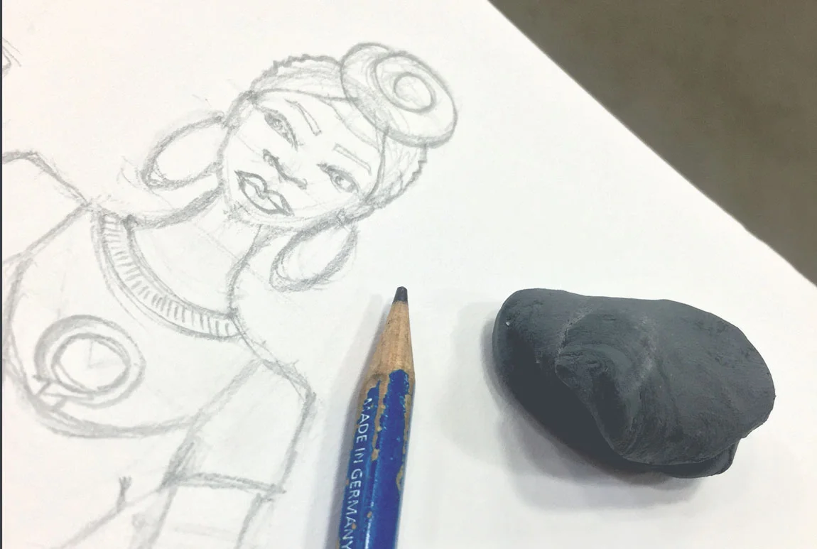 Fashion designer, Delaya Briscoe, designs the new wide legged leather jumper and pro feminism graphic t-shirt for the next generation black panther after being inspired by Black Panther the movie.