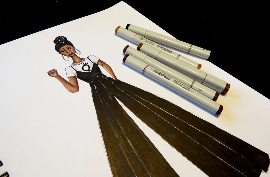 Fashion designer, Delaya Briscoe, designs the new wide legged leather jumper and pro feminism graphic t-shirt for the next generation black panther after being inspired by Black Panther the movie.