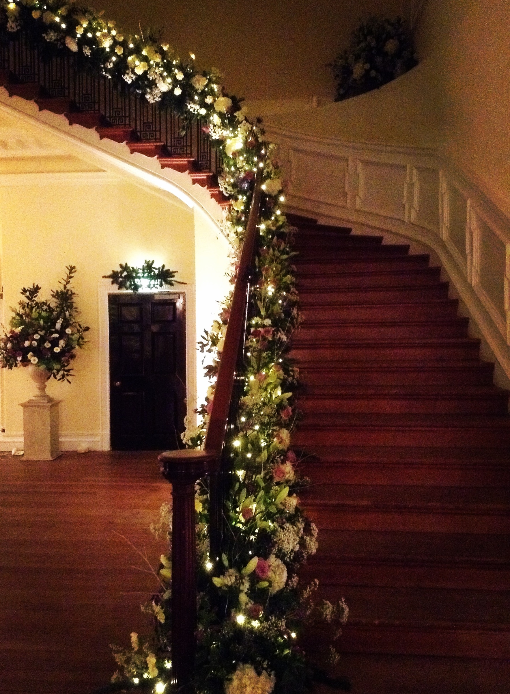 The staircase looking magical as evening comes. Executed by Paul Hervey-Brookes, Sue Robinson, Tracey Kennard and Andy McIndoe.