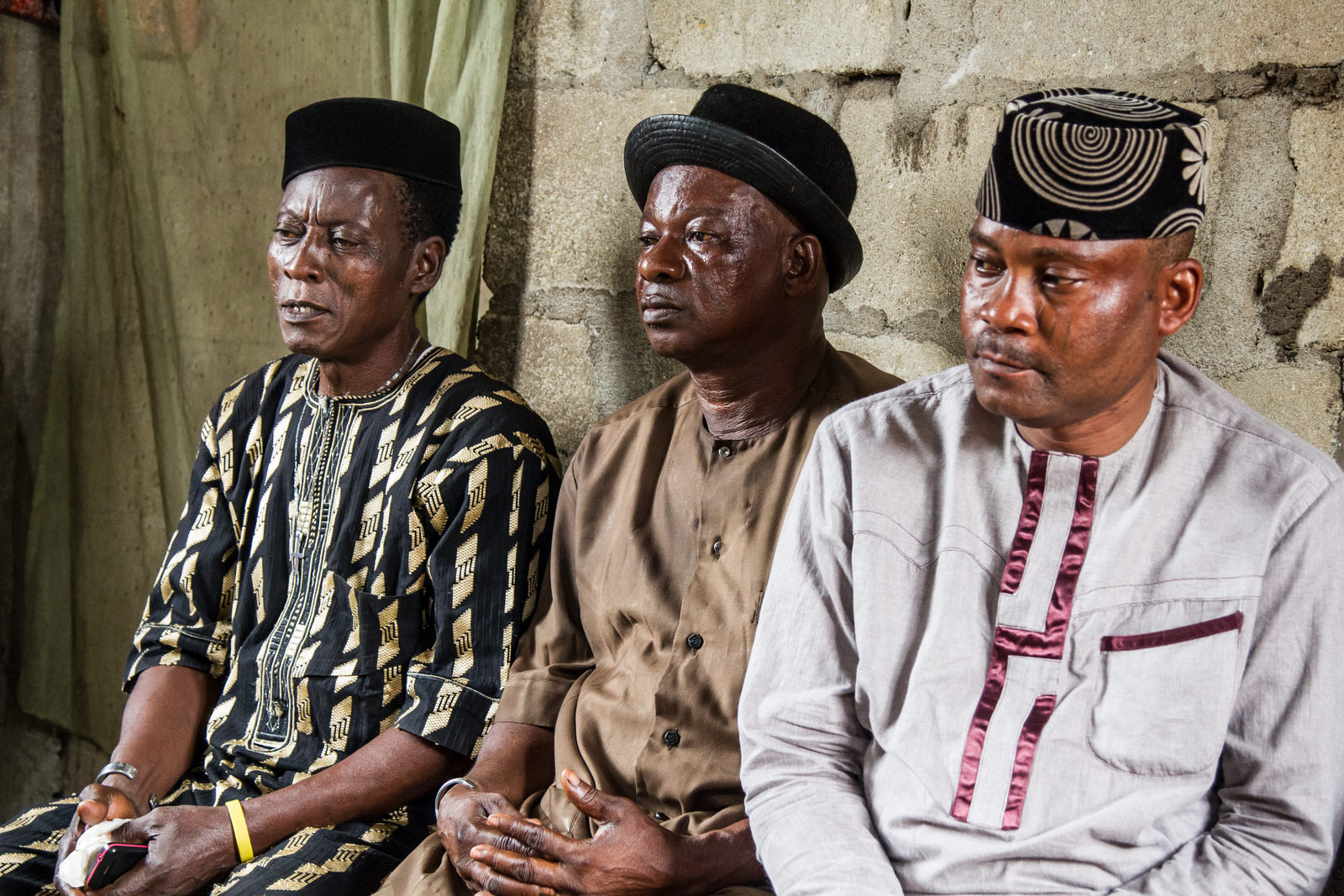  Paul Gandotoho (right), a community chief in the community, and Agban Aplanti (centre), a community elder discuss the evictions in Otodo Gbame. 