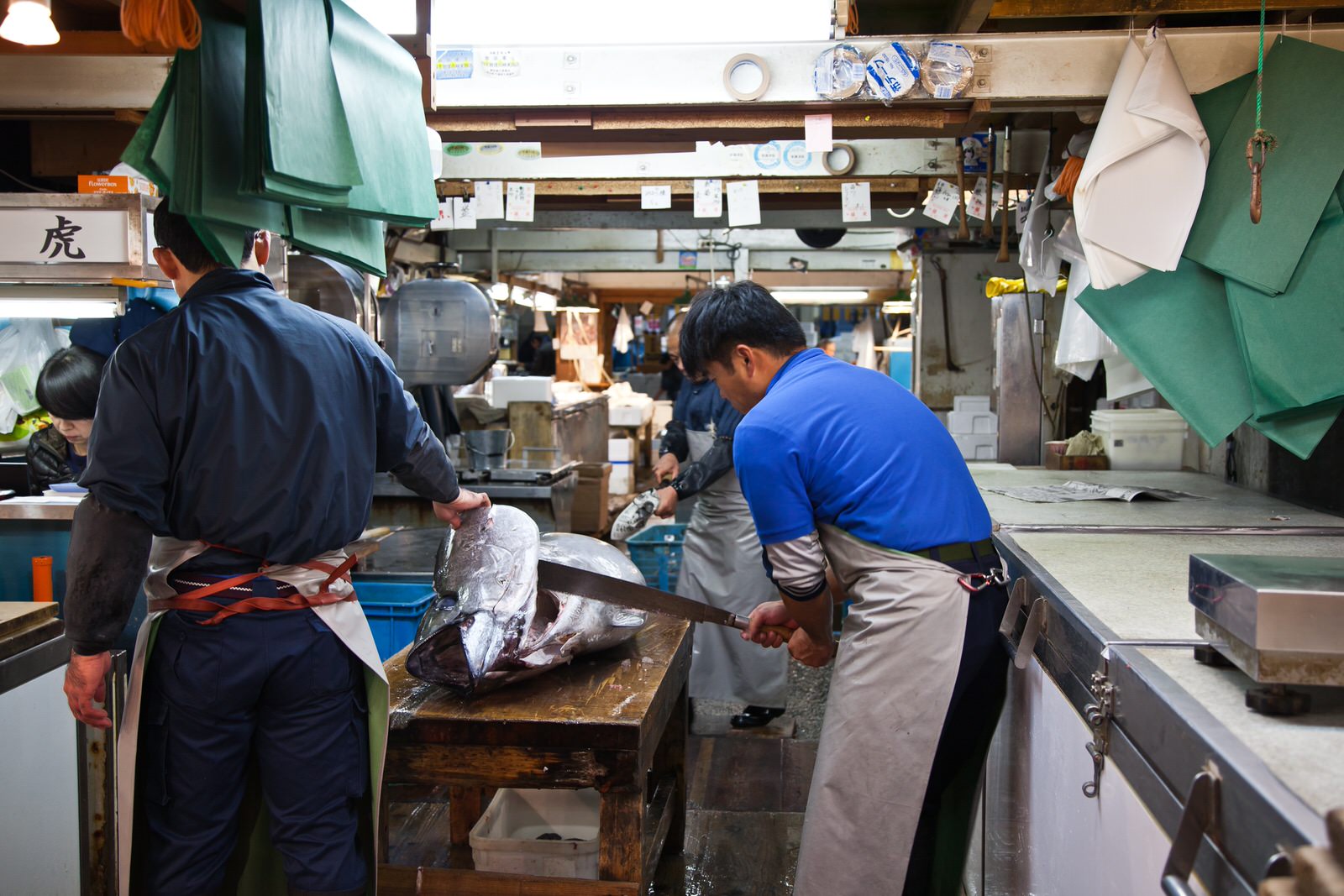  Some of the tuna from the morning's auction is taken directly to wholesalers in the market who waste no time in cutting the fish, ready for transportation to Tokyo's sushi restaurants. 