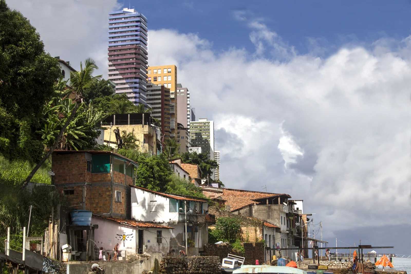 Luxury high-rise blocks overlook Gamboa de Baixo. This community has been segregated partly because of the construction of the Avenue Contorno, a large motorway that seperates the community from the city.