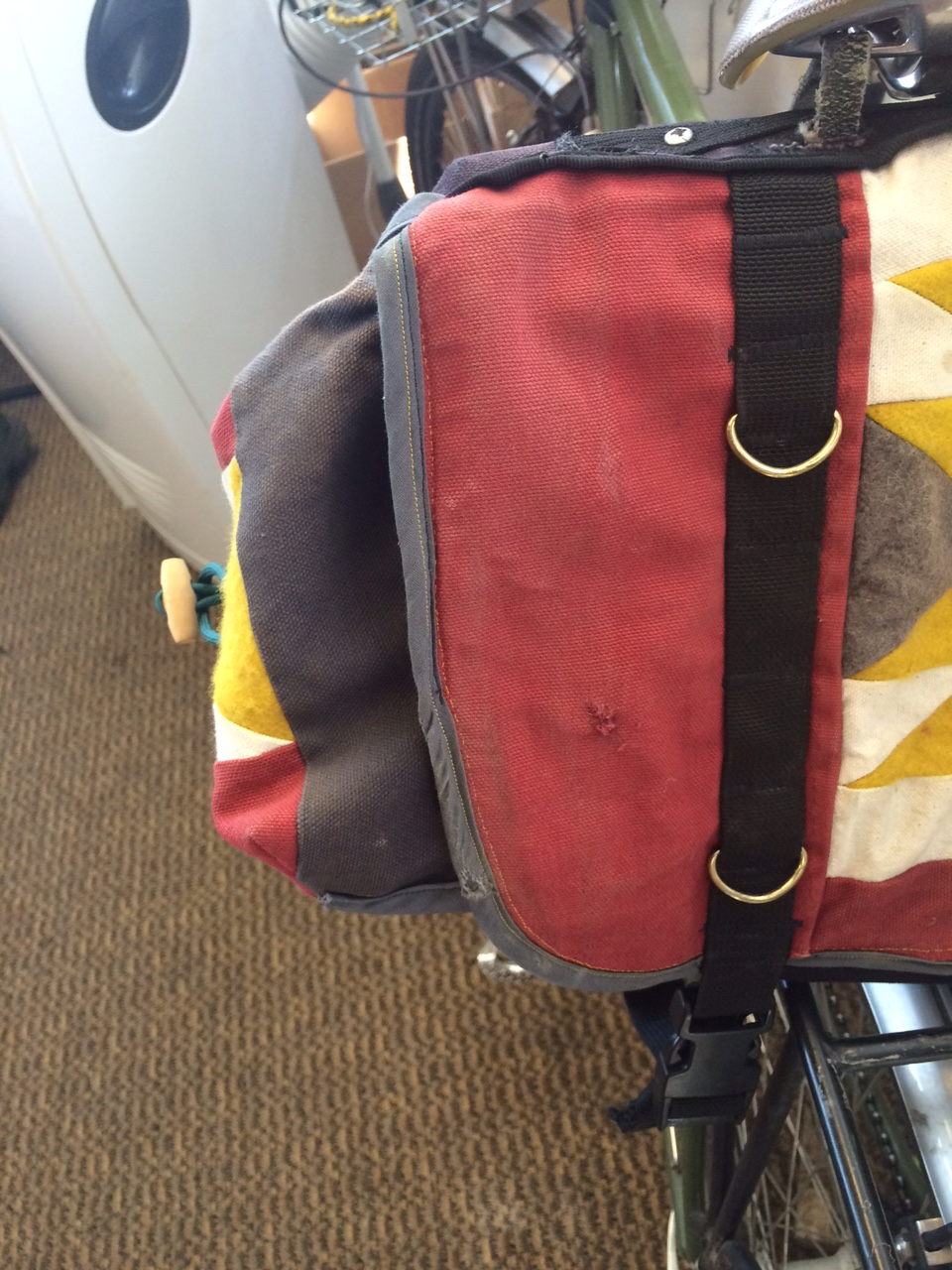 The little scuffs on my saddlebag where it hit the pavement--just enough to add some character.
