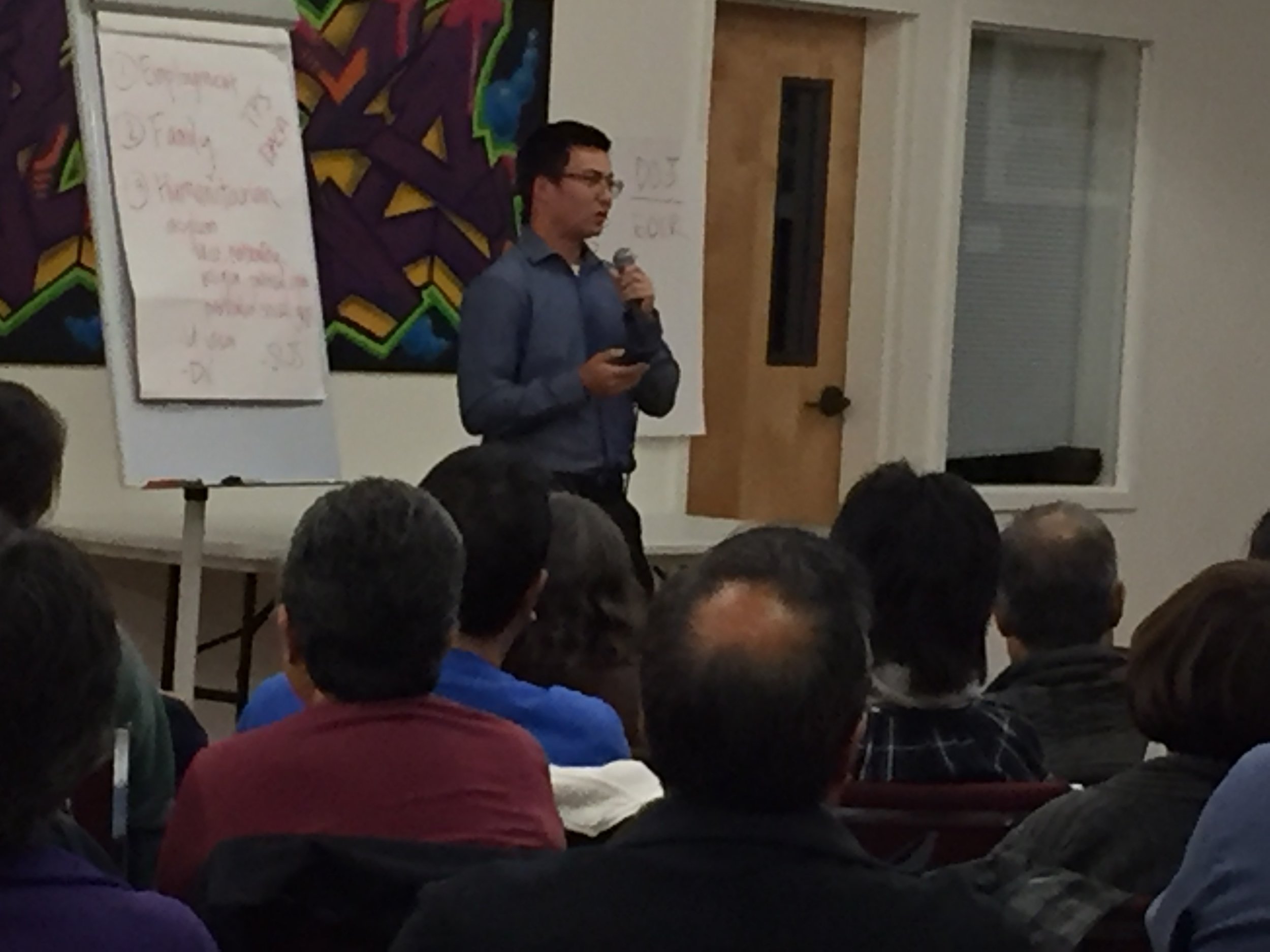 Justin Talbott speaking at Grace Fellowship Community Church about global migration patterns.