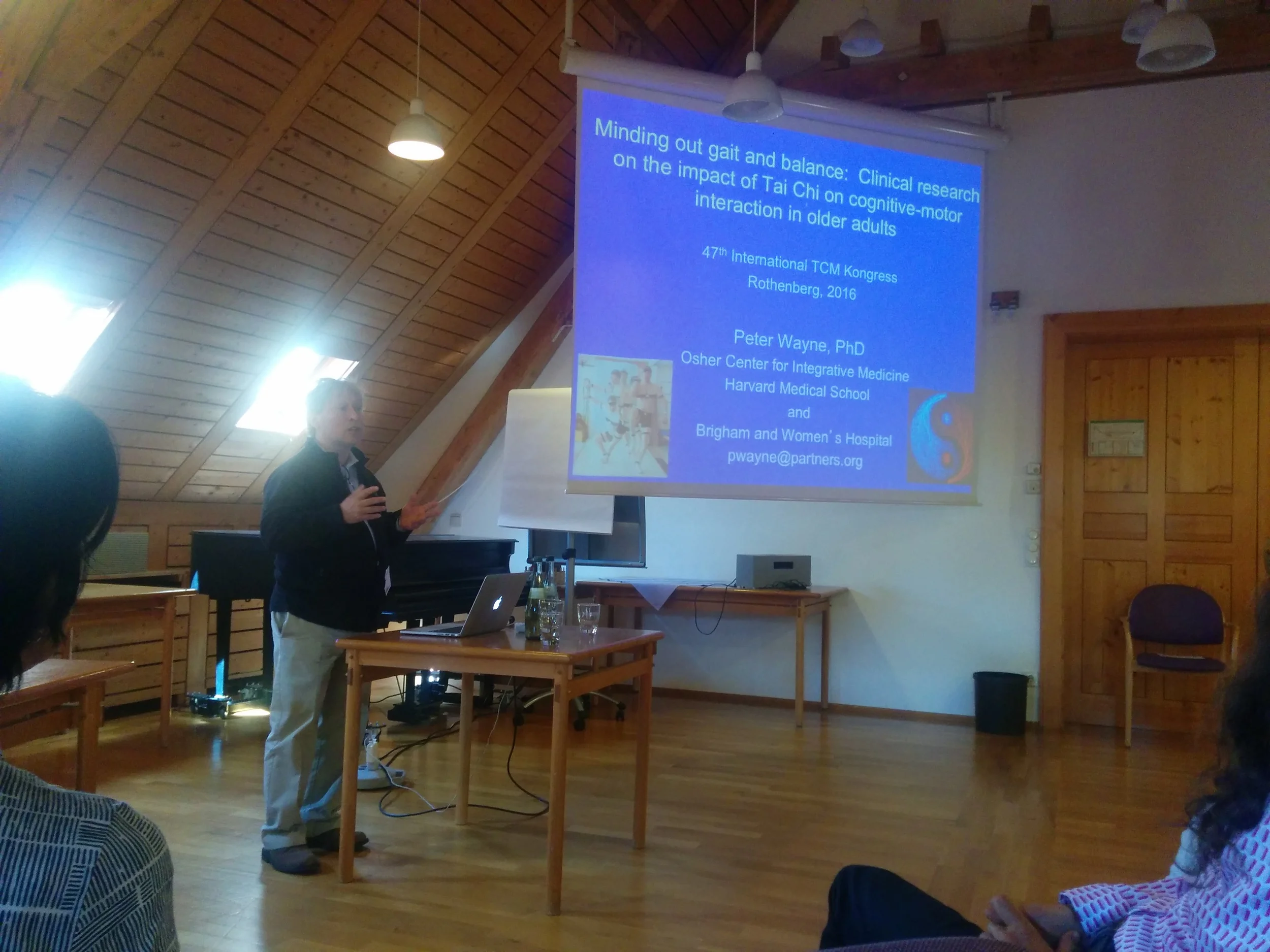 Professor Peter Wayne introducing his research on the impact of Tai Chi in older adults