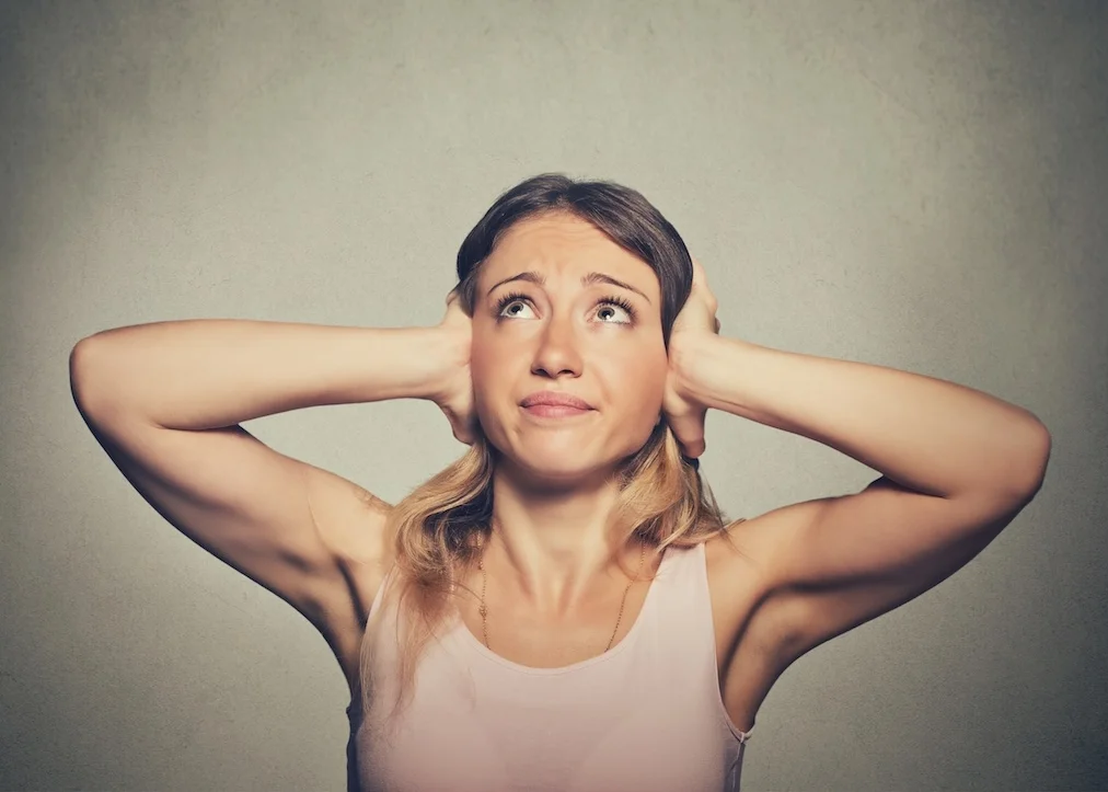 unhappy-woman-covering-ears-looking-up-stop-making-loud-noise-492844792_5143x4923.jpg
