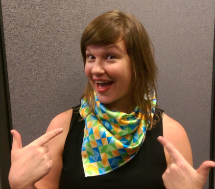 TAG Partners creative director Miranda Fuller shows off custom-designed scarves printed with the new TAG Partners logo. The dye sublimation-printed scarves were produced in TAG’s Nashville facility.