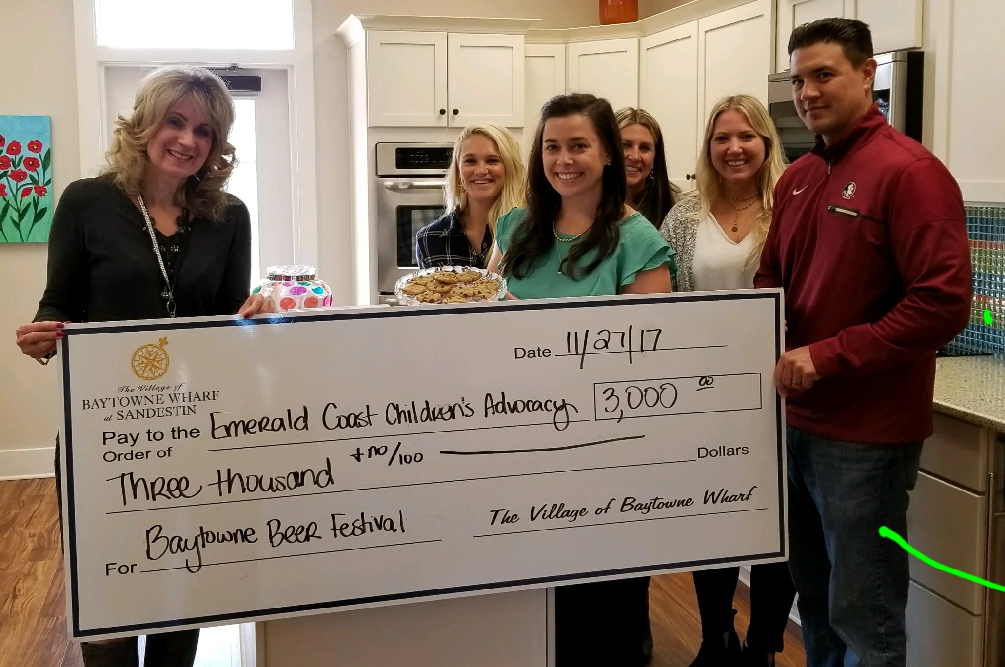 Baytowne Wharf at Sandestin staff at ECCAC’s DeFuniak Springs location to present a $3,000 check to the non-profit organization from their Beer Festival event. L-R Julie Hurst, Chelsea Fox and Kim Henderson from ECCAC with Julie Stuckey, Leighann Elliott and Alan Meyers from Baytowne.