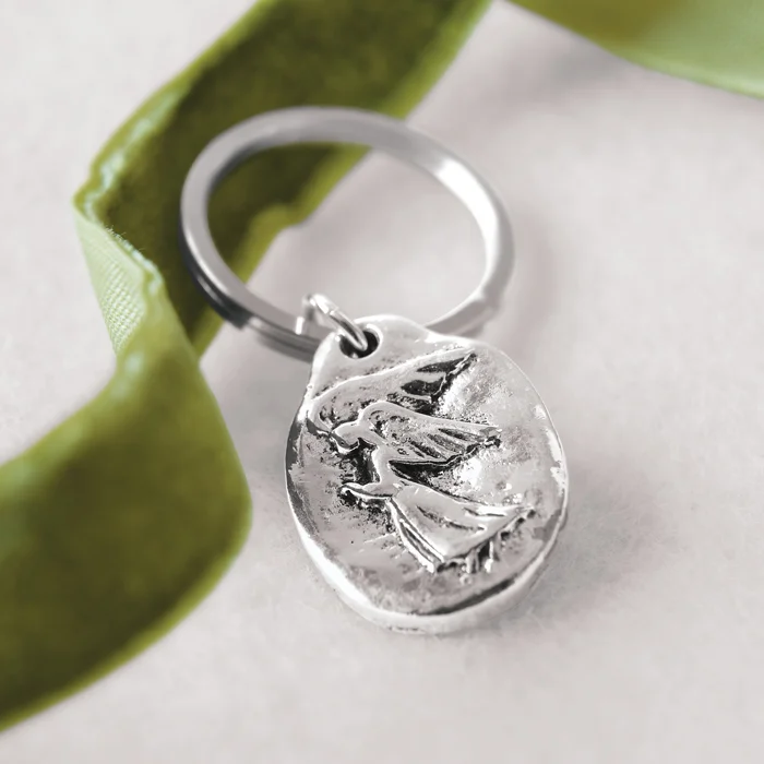 Carry our ethereal Guardian Angel keepsake as a daily reminder of peace, guidance and grace. Silver key ring and hand made charm come beautifully presented in a hand crafted wood crate with ribbon.