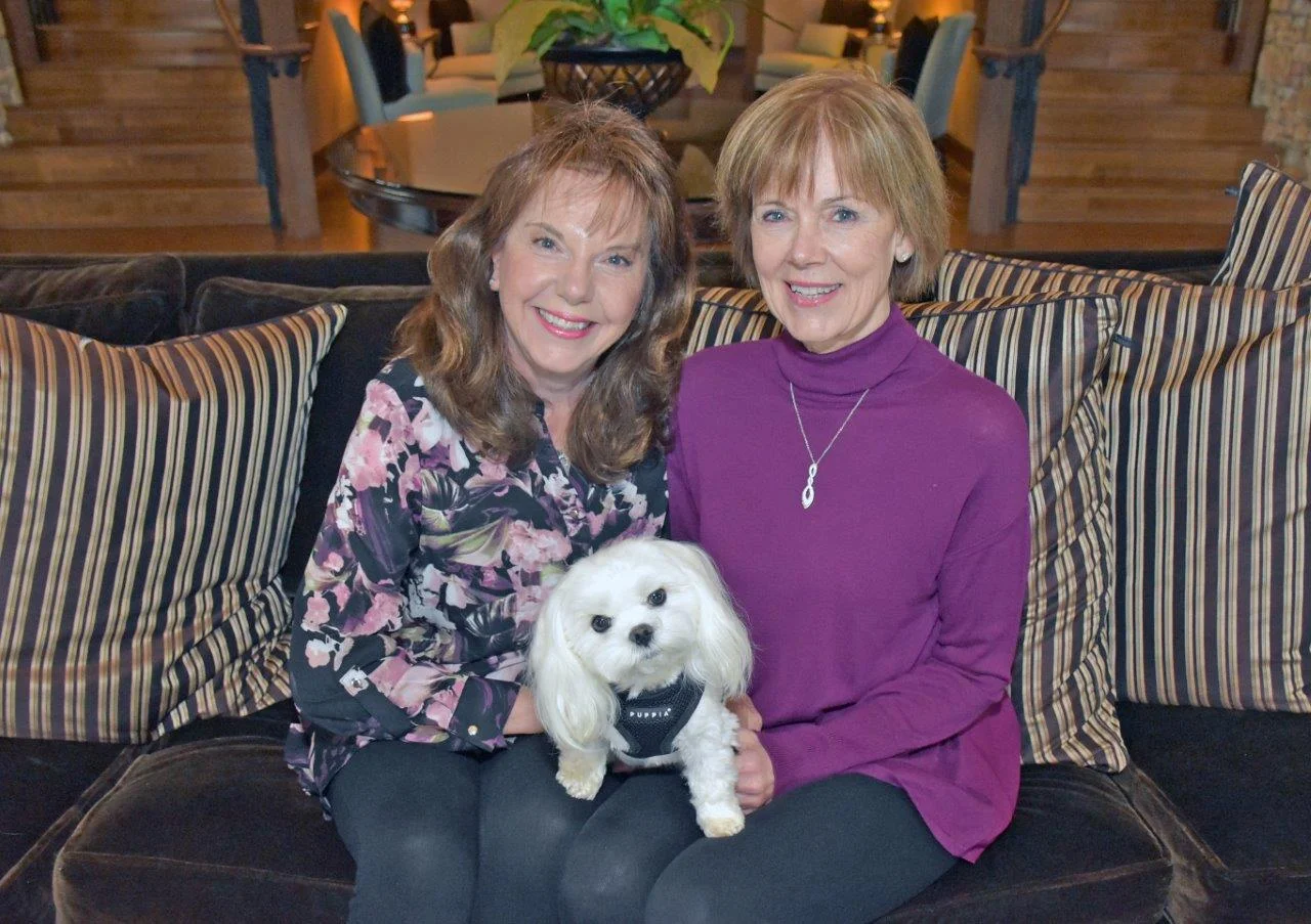 Abbey, the 4-year old Maltese therapy dog for ECCAC and VPS airport, with owner/handlers Roslyn Lindeman and Jennifer Town.