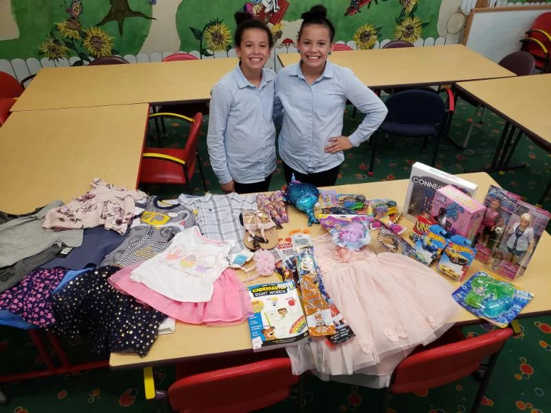 This is Gabriela and Graciela Mercado. In lieu of receiving gifts for themselves at their 12th birthday party, they asked their friends to bring gifts for ECCAC children. Mom says the girls have grown up knowing about the Center from a young age and frequently donate their dresses they have outgrown to us!