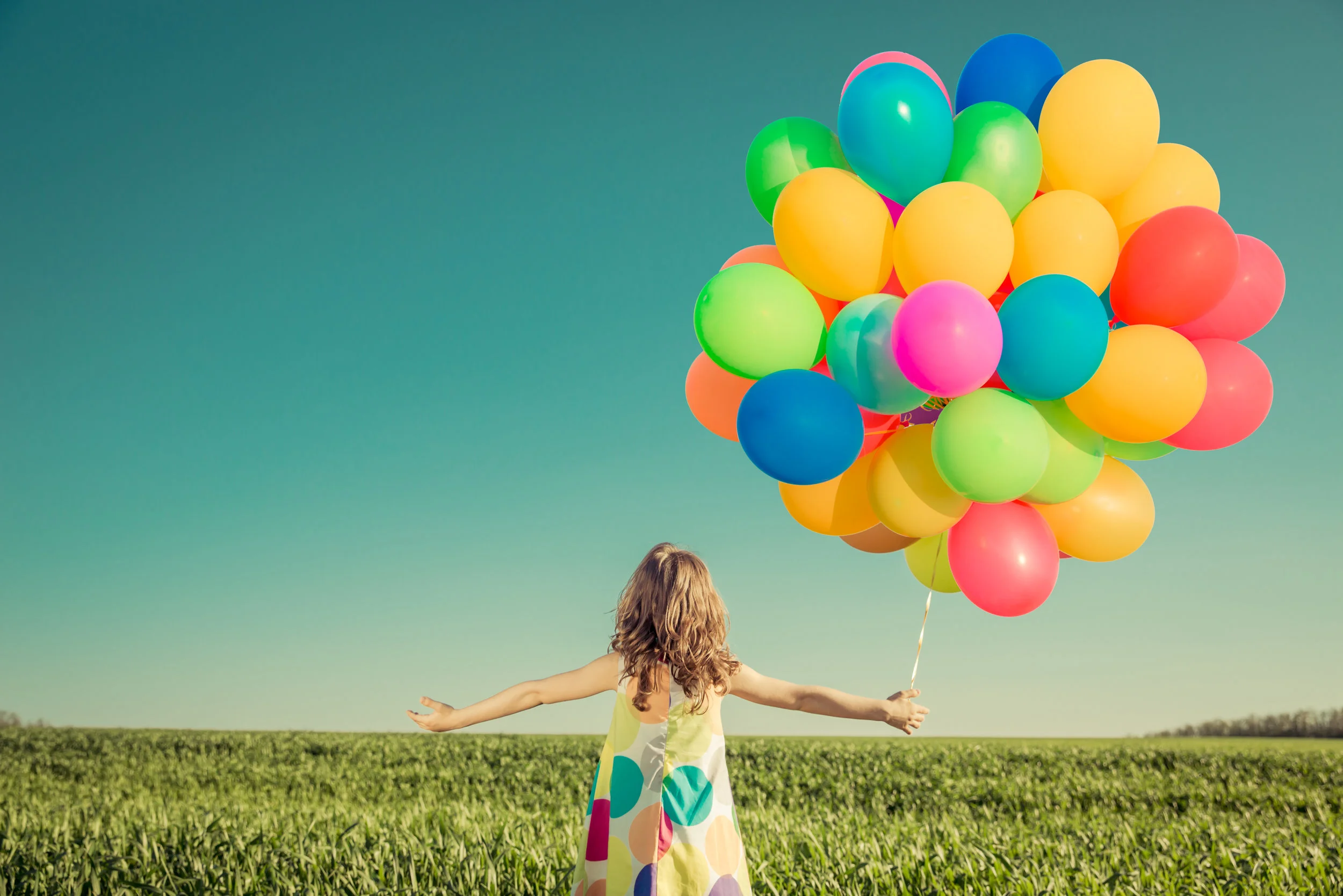 girl with balloons shutterstock_605538734.jpg