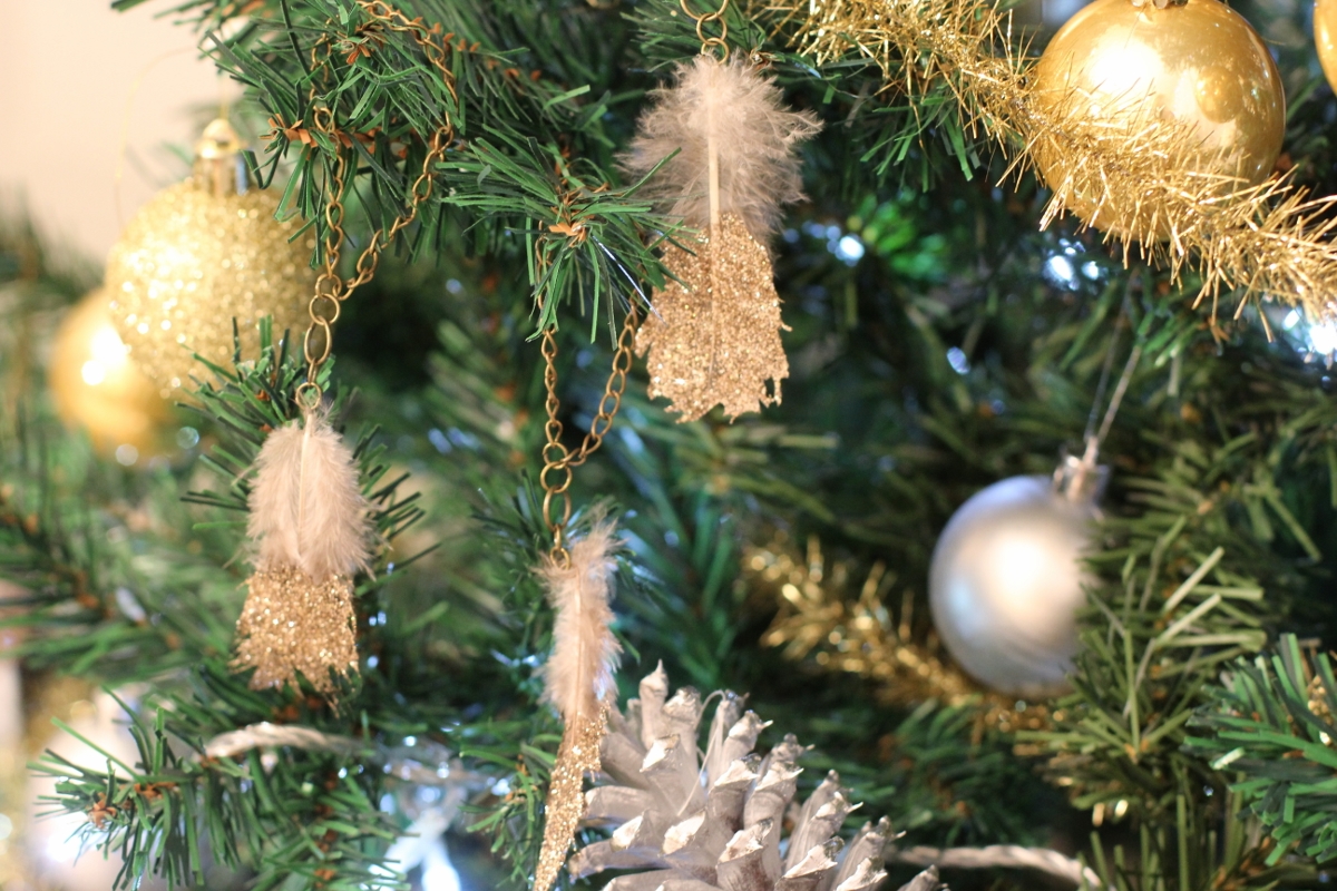 Glitter Feather Ornaments -- So delicate! They kind of add a fun boho/glam vibe! love.
