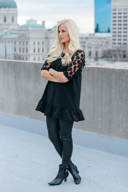 I love an all black party look. The edgy leather pants are a nice contrast with this delicate top.