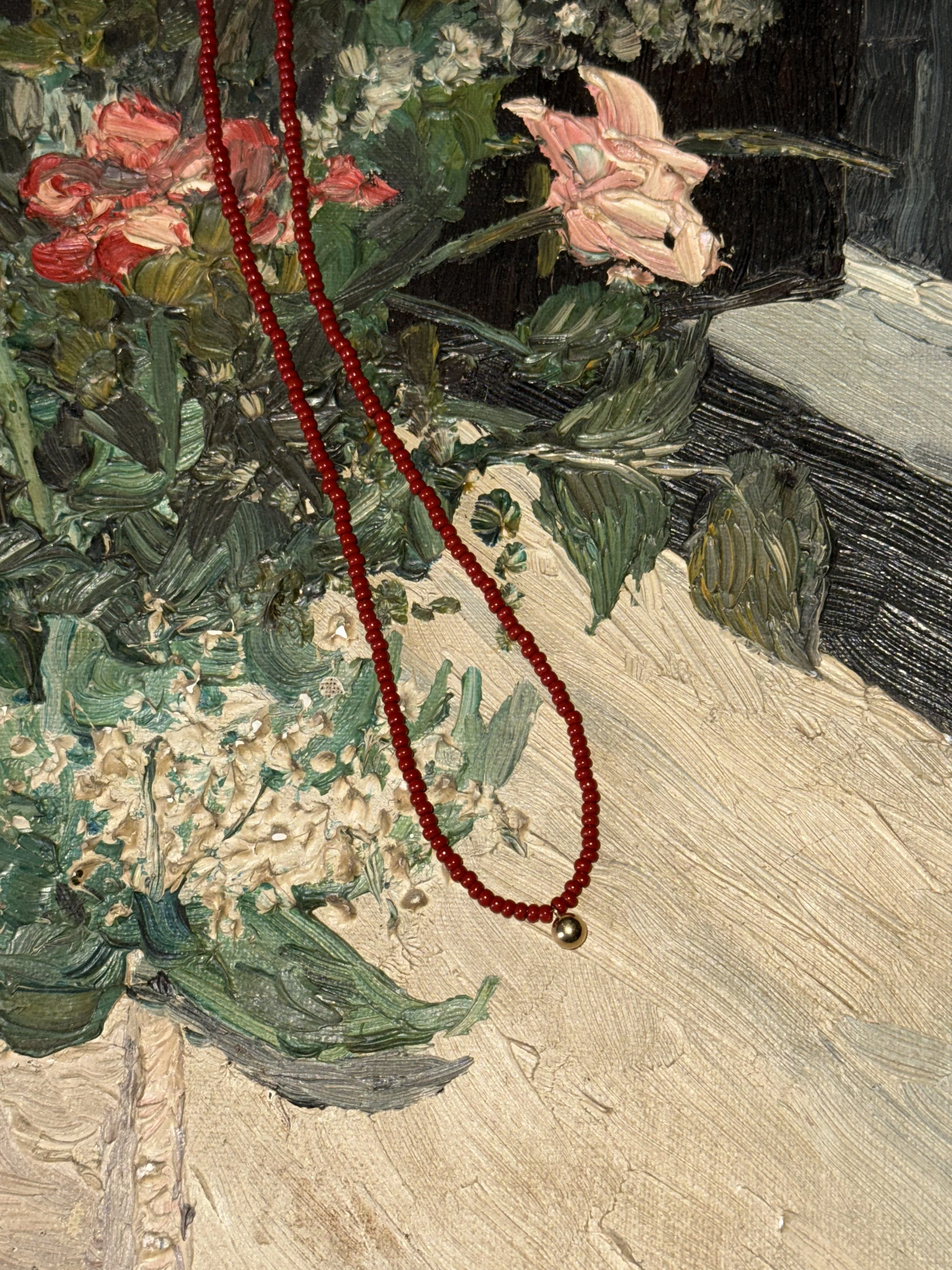 Long ball charm necklace