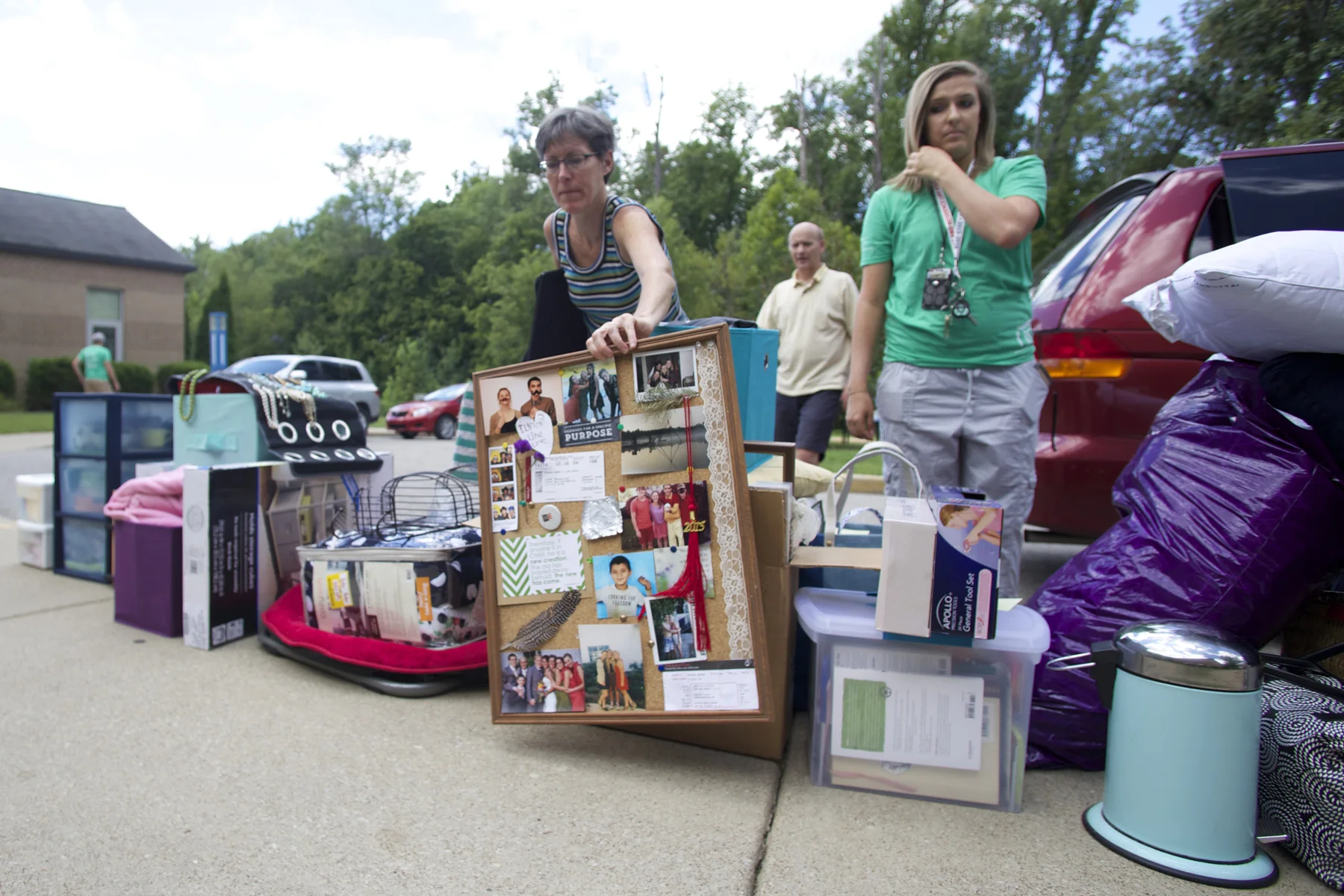 A mother unpacks the car of her child's belongings as students moved into the dorms of USI in August of 2015. (Shot for The Shield)