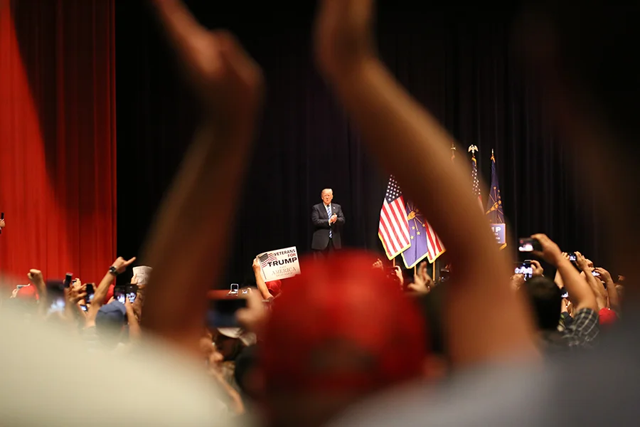 Republican presidential candidate Donald Trump takes to the stage as many supporters stand and welcome him April 28 at the Old National Events Plaza in Downtown Evansville. (Shot for The Shield)