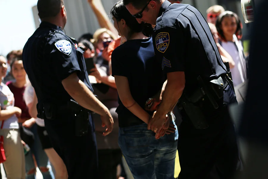 A protestor gets arrested for public indecency after the Trump Rally April 28 outside of the Old National Events Plaza. (Shot for The Shield)