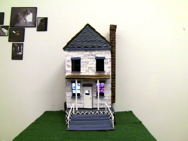 "in this house that i call home" Cardboard, paper, glue, small DVD player 