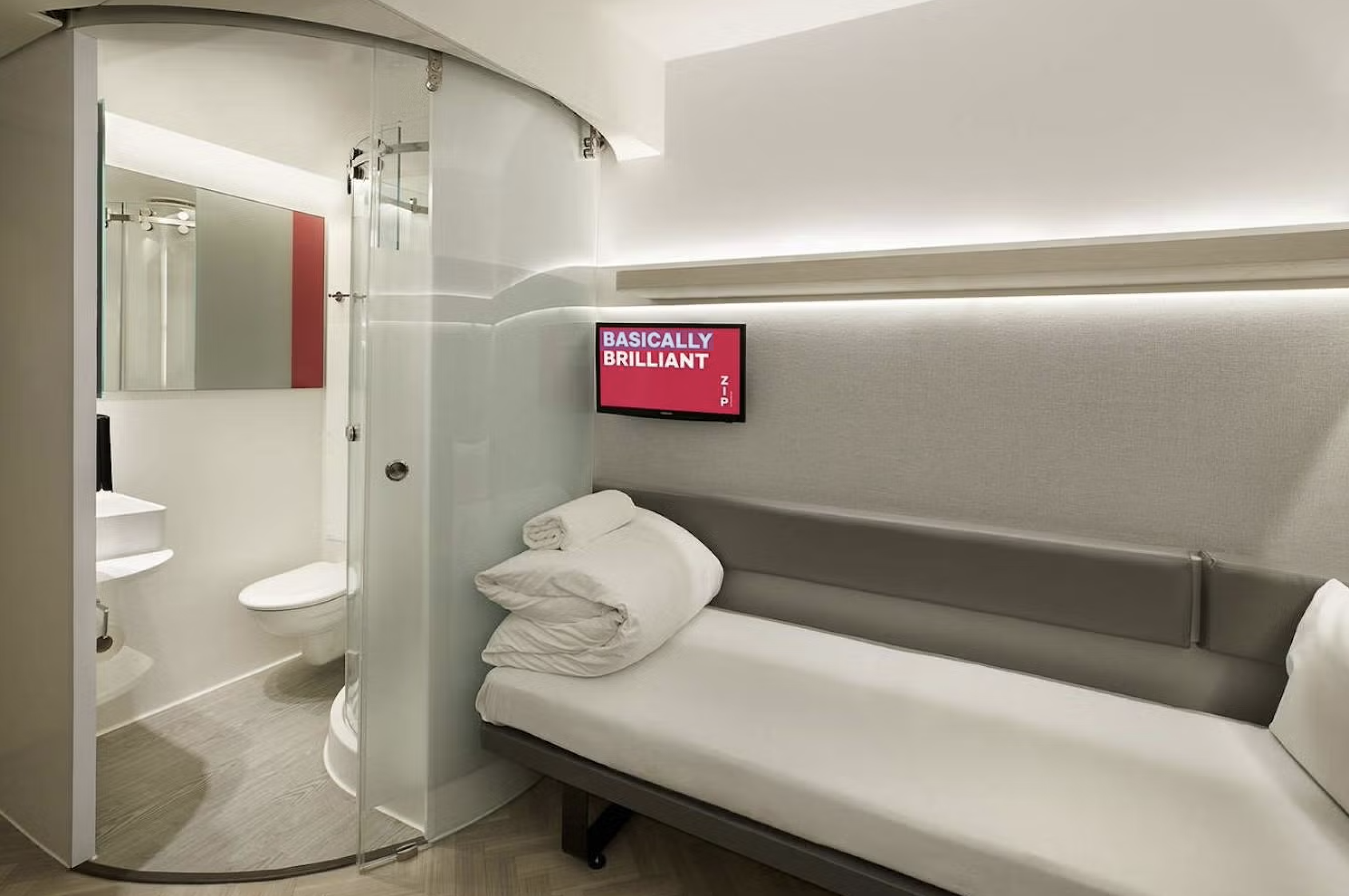   Customer experience environment  The ZIP identity integrated across room design, signage and spatial graphics. 