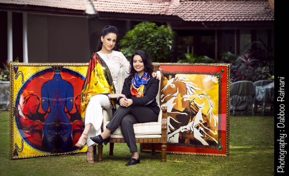 Oscar Wilde wrote, ”One should either be a work of art or wear a work of art,” and now muralist and artist Rouble Nagi is presenting us with a chance to do the same. Rouble Nagi is all set to launch her limited Edition Art scarves. The scarves are versatile and present a range of innovative and unique designs depicting her vividly colourful signature paintings. Celebrating women, the collection features some of Rouble's most iconic works. Rouble’s scarves are not only a way to embrace her works physically but also translate something formal and flat into something luxuriously tactile and luscious to the touch. The artist expressed enthusiasm for the project saying she is happy Amruta Fadnavis is also a part of it. “I find Amruta Fadnavis incredibly close to the common woman. Not only is her simplicity appreciable but she is a very inspiring lady. Like lakhs of other working women, she manages to multi task by stepping in roles of a doting mother, wife, homemaker and a professional banker. My collection is for the woman of today, and am happy Amruta is a part of my new series.” All the proceeds from Rouble’s art scarves collection will go for children’s education and women empowerment programs.
