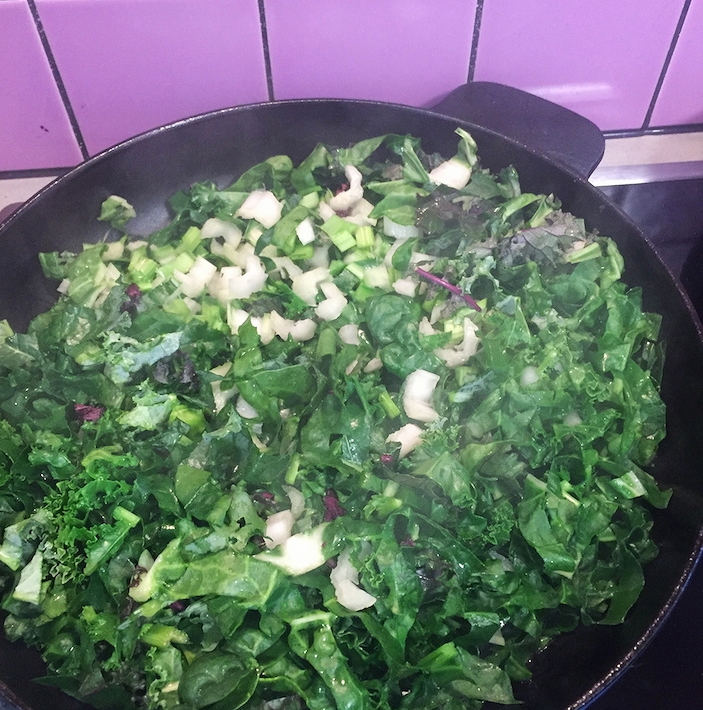 Cooking fresh greens from the garden. 
