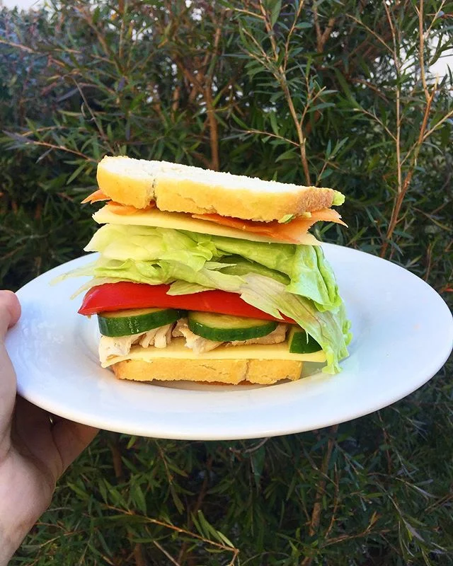 Sandwich perfection - hummus, cheese, chicken, cucumber, capsicum, lettuce, cheese, carrot, avocado on homemade sourdough 👌