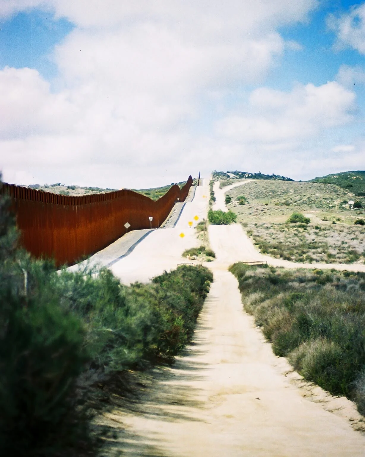I kneel to the dusted concrete and swap a stone from one side to the other. Mexico to US. US to Mexico. Impassable during high water, 300 ft. Porous on the ground. Borderless at the earth.

At the Southern Terminus of the Pacific Crest Trail. March 2