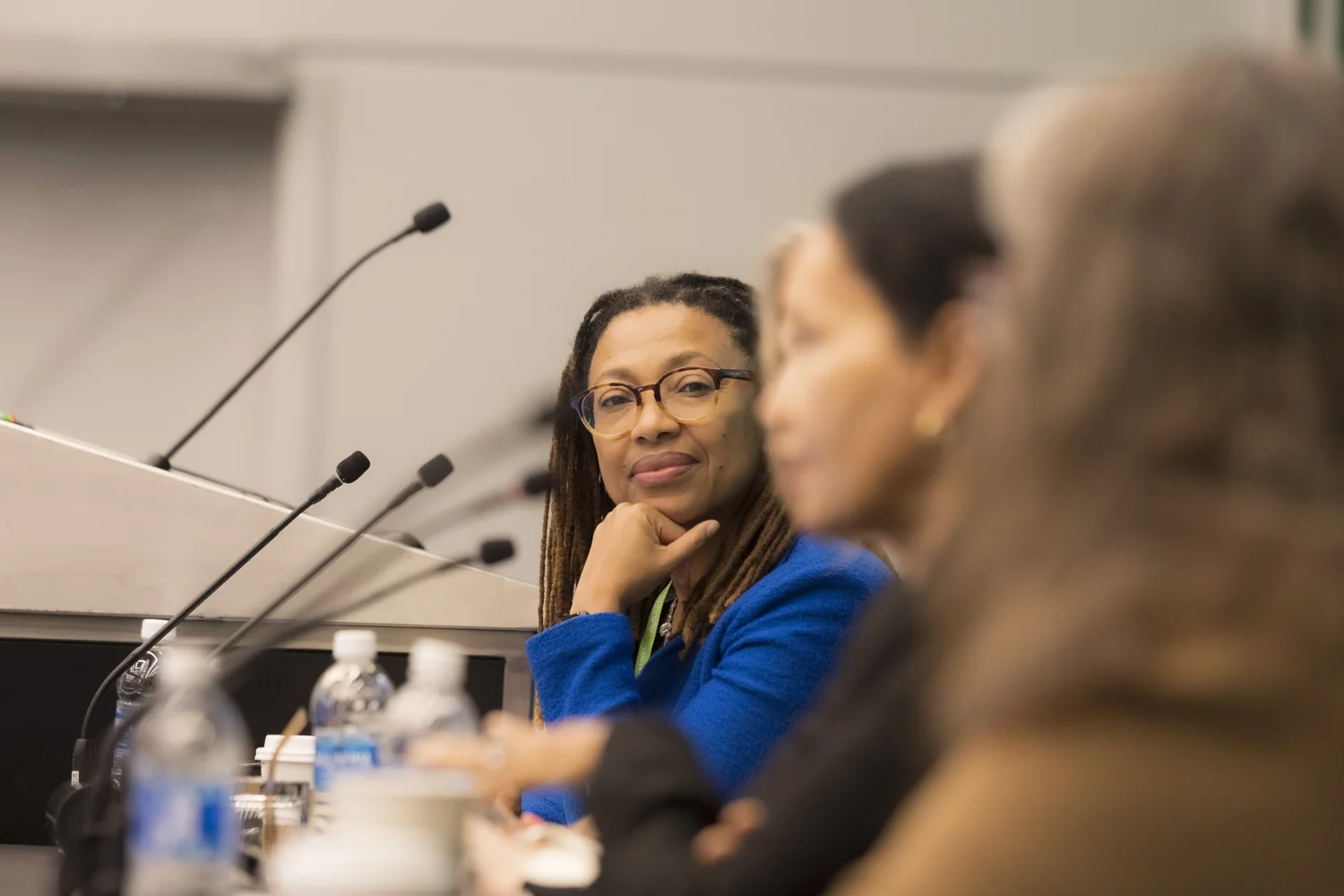 Professional convention photographer covering a panel discussion