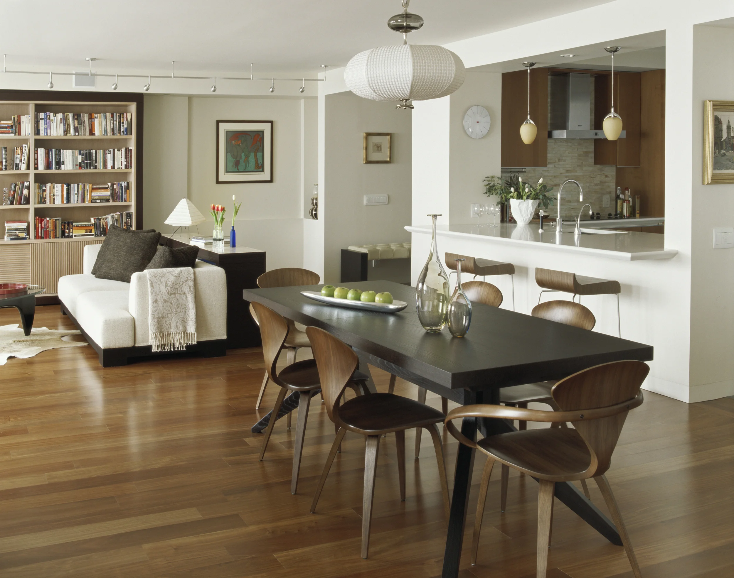 Dining Room Multi functional space with kitchen, dining & living room all in modern setting. Joshua Mc.Hugh photographer
