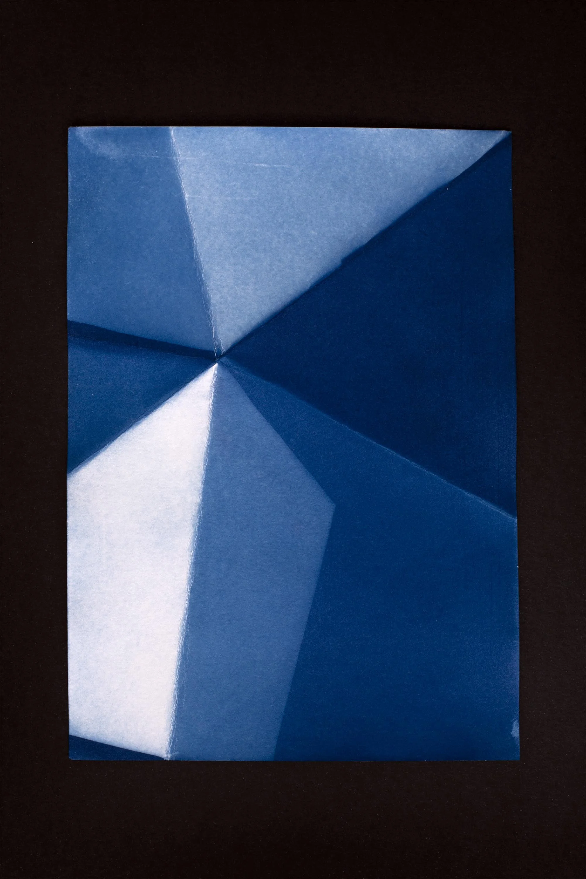  cyanotype on paper, folds, sunlight       