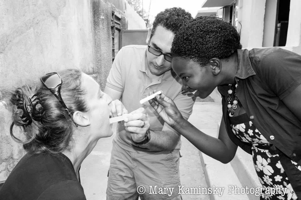 Our Master Trainer, Violah, practicing physical exam skills with Dr. Lisa and Dr. Gabriel, Mbale, 2013 (photo credit Mary Kaminsky Photography )