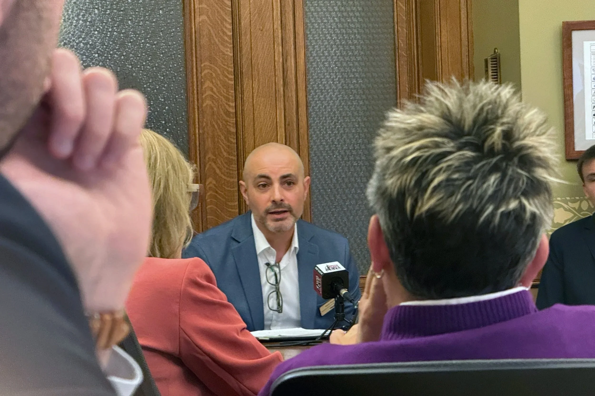 Matt Reetz speaks to a room of legislators and public participants at a Wisconsin State Senate hearing