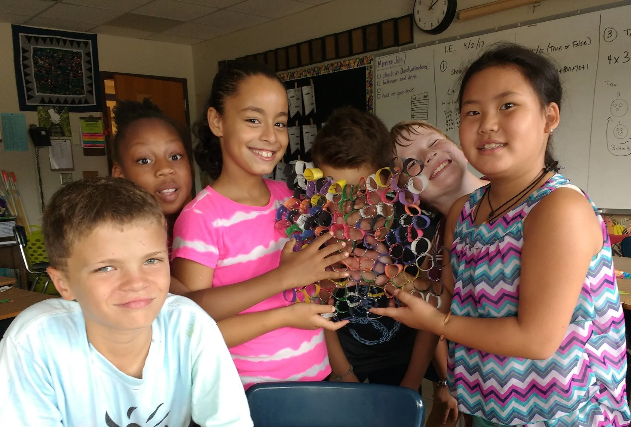 Students at Lincoln Elementary work together to build their own honeycomb. They learned a lot about hive geometry! MAS Photo
